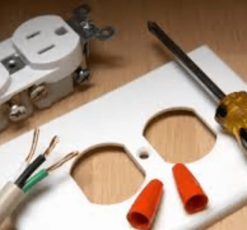 plugin outlet plate with tools and wires